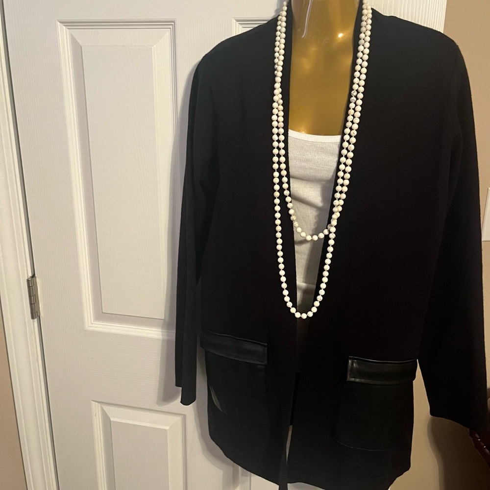 Black sweater with faux leather pockets